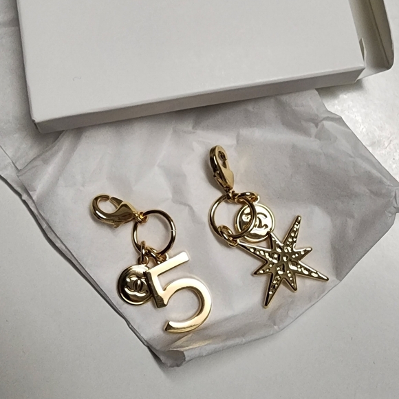 Chanel 2 Pcs Gift Collection Gold Tone No5 and Star Key Bag Charms Authentic New